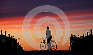 Cyclist Looking Into The Sunset