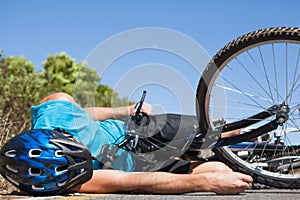 Cyclist lying on the road after an accident