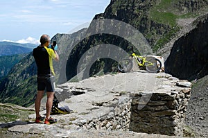 Cyclist making a photo with a smartphone of his mountain bike