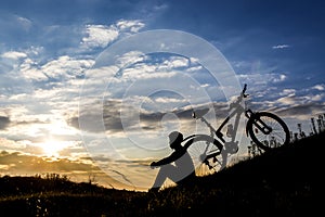 Cyclist man silhouette and mountain bike