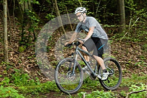 Cyclist on a mountainbike in a downhill photo