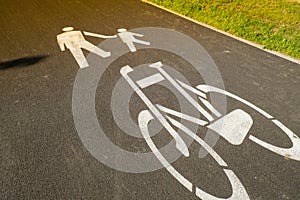 Cyclist and pedestrian route zone sharing sign on a street. Painted Street Asphalt Bicycle Lane Sign White Safety. Road