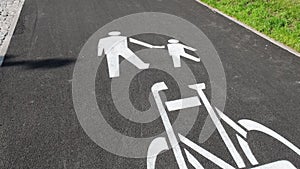 Cyclist and pedestrian route zone sharing sign on a street. Painted Street Asphalt Bicycle Lane Sign White Safety. Road