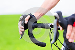 Cyclist on race bike pedaling on bike track