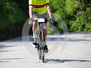 cyclist with racing bike and sportswear while pedaling fast thro