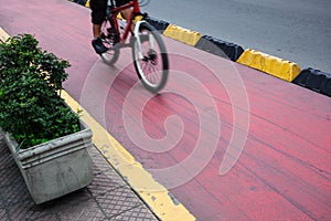 cyclist on a red bike path