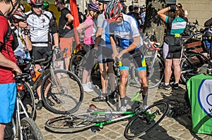 LVIV, UKRAINE - MAY 2018: The cyclist repairs his bicycle by pumping a punctured wheel