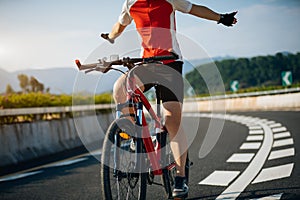 cyclist rides a racing bike on road