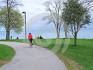 A cyclist rides on the trail