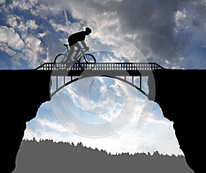 Cyclist riding across the bridge