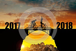 Cyclist riding across the bridge into the New Year 2018.
