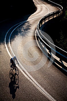 Cyclist riding along a mountain road