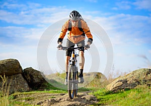 Cyclist Riding the Bike on the Beautiful Mountain Trail