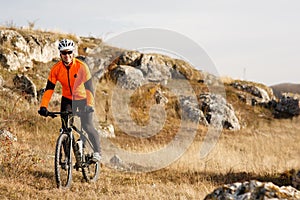 Cyclist Riding the Bike on the Beautiful Spring Mountain Trail
