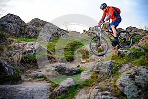 Cyclist Riding Mountain Bike on the Beautiful Spring Rocky Trail. Extreme Sport Concept
