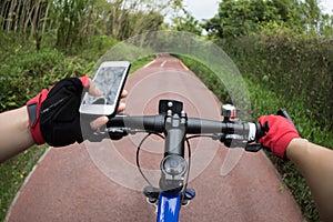 cyclist riding mountain bike on trail in forest