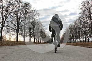 Cyclist riding on a paved road