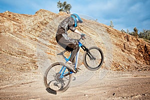 Cyclist riding on the rocky mountains