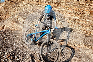 Cyclist riding on the rocky mountains