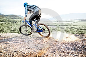 Cyclist riding on the rocky mountains