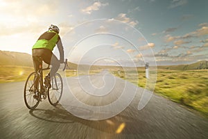 Cyclist on a road at full speed