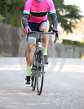 Cyclist with sportswear on a racing bike pedaling