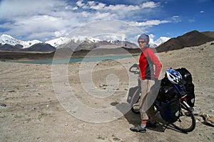 Cyclist among stunning Tibeten landscape