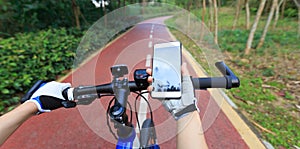 Cyclist using smartphone for navigation when riding