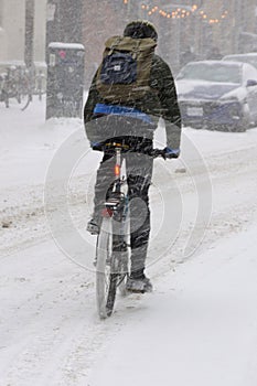 A cyclist in winter snow