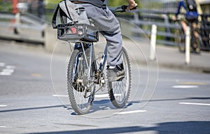 Cyclists active lifestyle lovers ride bikes along city street alongside other traffic