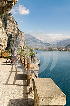 Cyclists admire the panorama from the Ponale trail in Riva del G