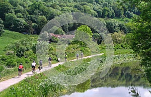 Cyclists along a canal