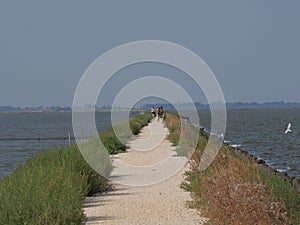 cyclists along the dirt path through the lagoons