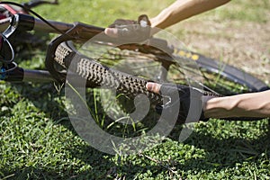 Cyclists are checking bicycle wheels, Close-up