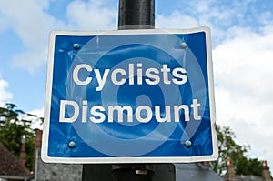 Cyclists Dismount sign