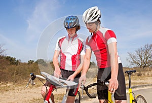 Cyclists looking at a map