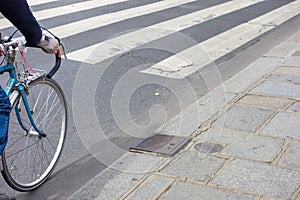 Cyclists on a Paris street just before a zebra crossing, Paris, May 2014