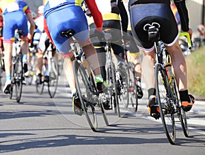 cyclists pedal fast on the road