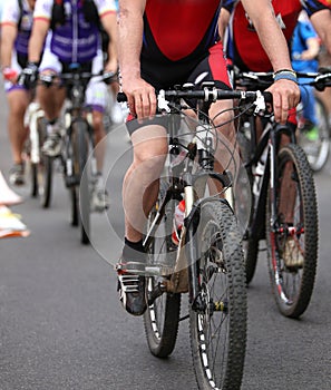 cyclists pedal quickly through the streets during the sporting e