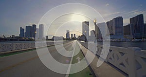 Cyclists pov biking on the Venetian Causeway Miami Beach towards downtown 4k 60p