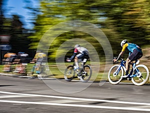 Cyclists in a race panning technique