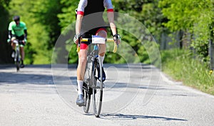 cyclists with racing bikes and sportswear while pedaling on the