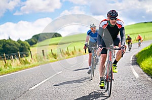 Cyclists racing on country roads