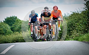 Cyclists racing on country roads