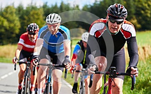 Cyclists racing on country roads