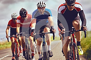 Cyclists racing on country roads