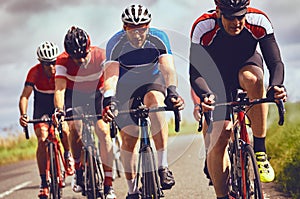 Cyclists racing on country roads photo