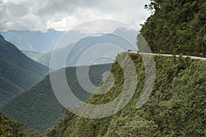 Cyclists riding on the Death Road - the most dangerous road.