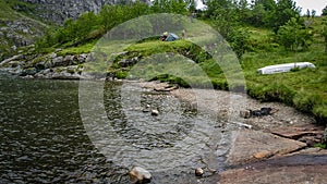 Cyclists stopped to rest on the fjord in Norway