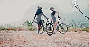 Cyclists, stretching and women in nature with bicycle or bike for sports, training and exercise. Forest, fitness and